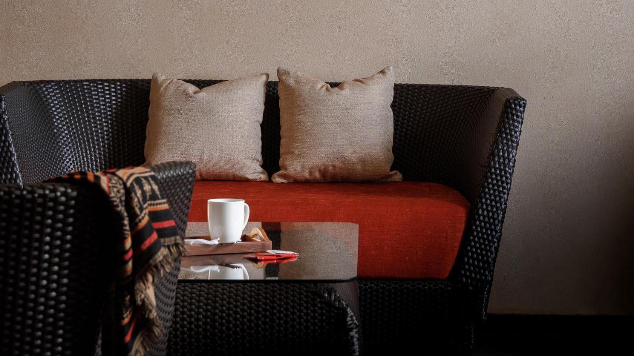 The Panoramic Getaway Hotel Munnar Kültér fotó A rattan sofa