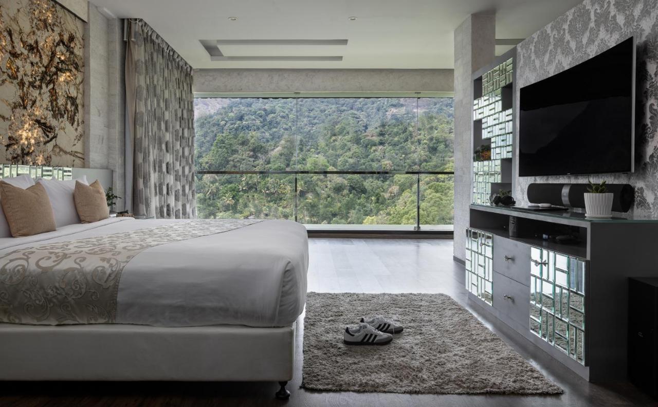 The Panoramic Getaway Hotel Munnar Kültér fotó A bedroom at the hotel