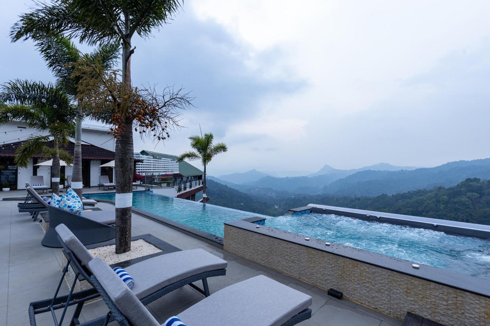 The Panoramic Getaway Hotel Munnar Kültér fotó The swimming pool at the resort